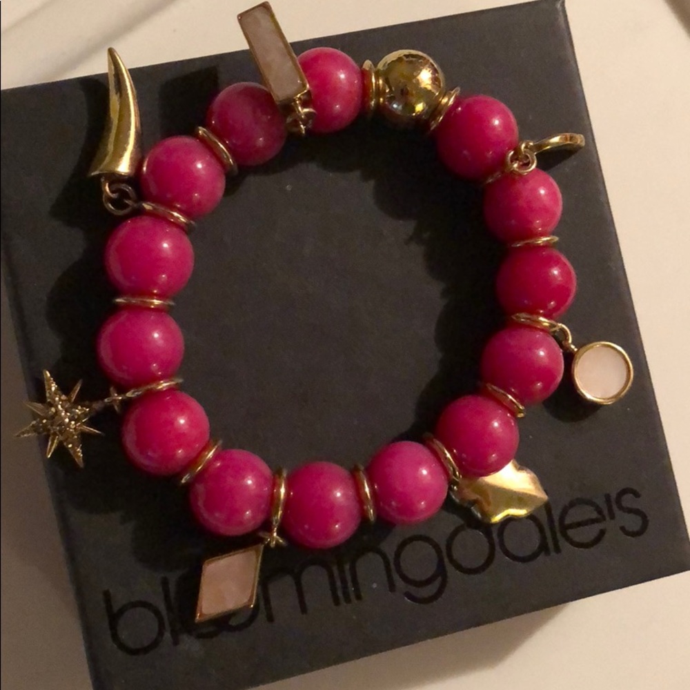Pink bracelet with charms from Bloomingdales.